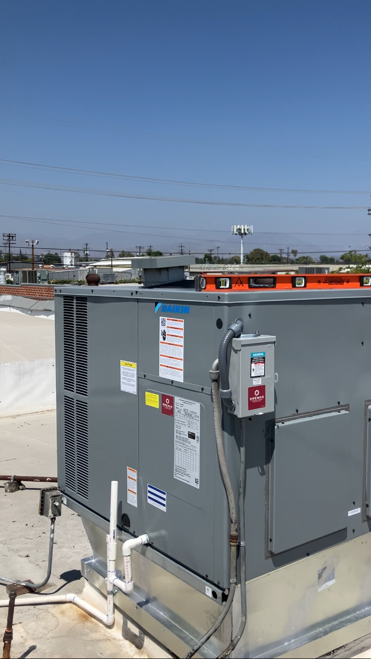 HVAC technician testing electrical and airflow components on a malfunctioning central air system