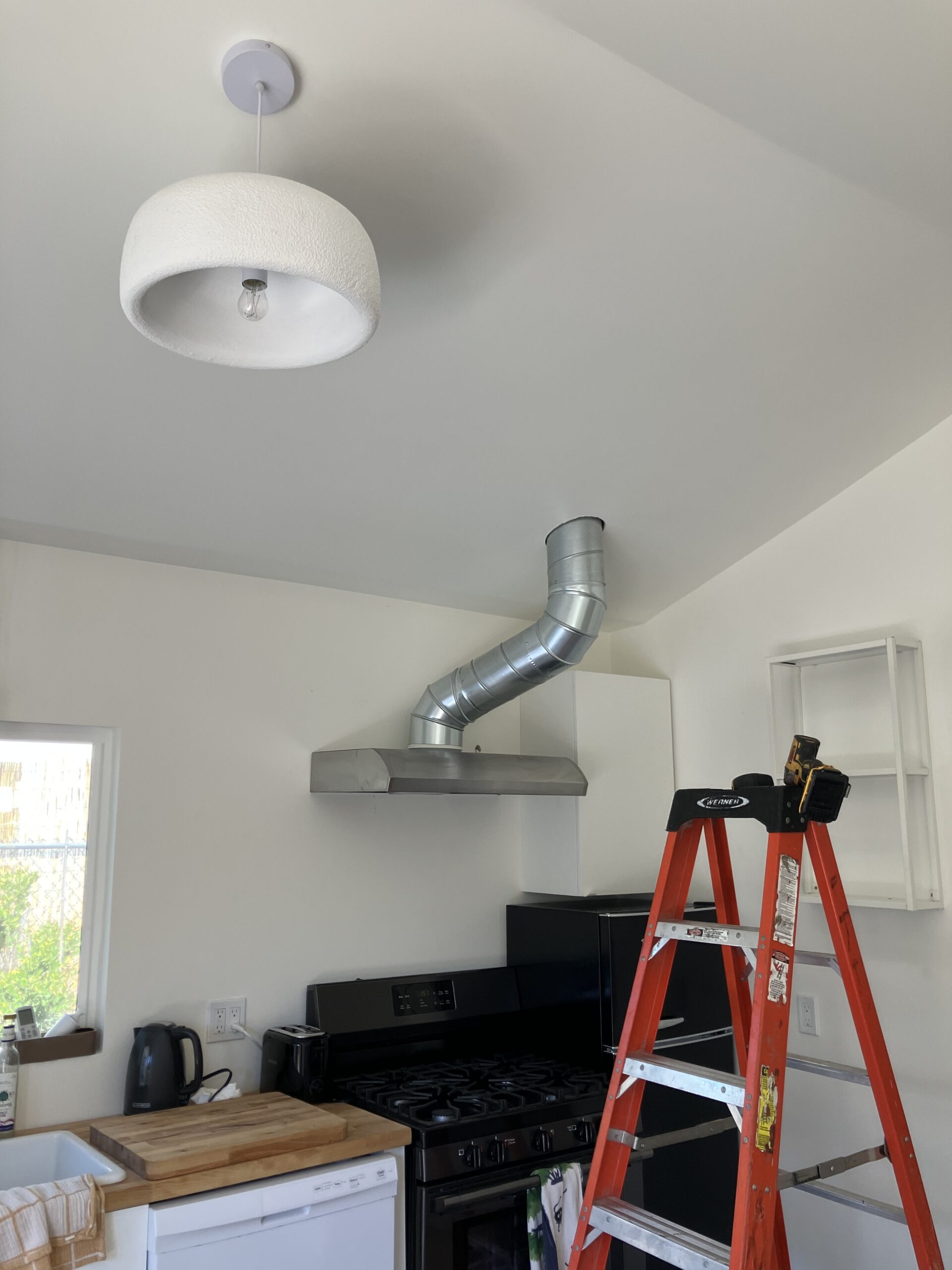 Experienced HVAC technician testing furnace controls and airflow with professional diagnostic tools