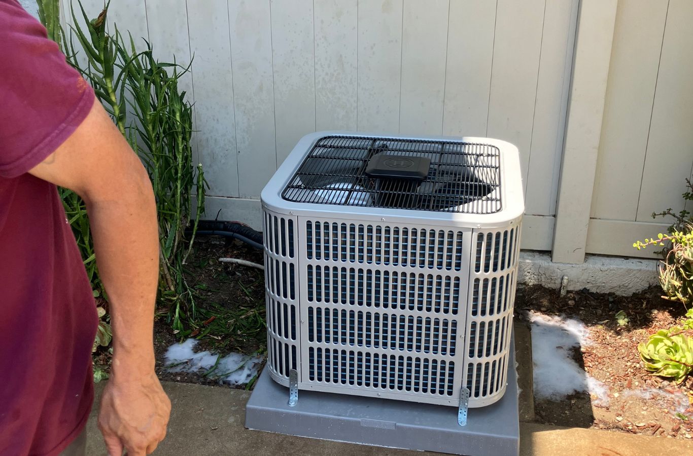 Experienced HVAC technician inspecting AC components and measuring system performance indoors. AC Repair near me.